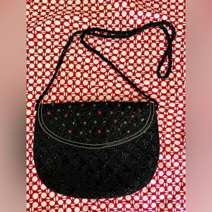 Royal Hock beaded black purse with red & gold beaded accent. 32” beaded strap